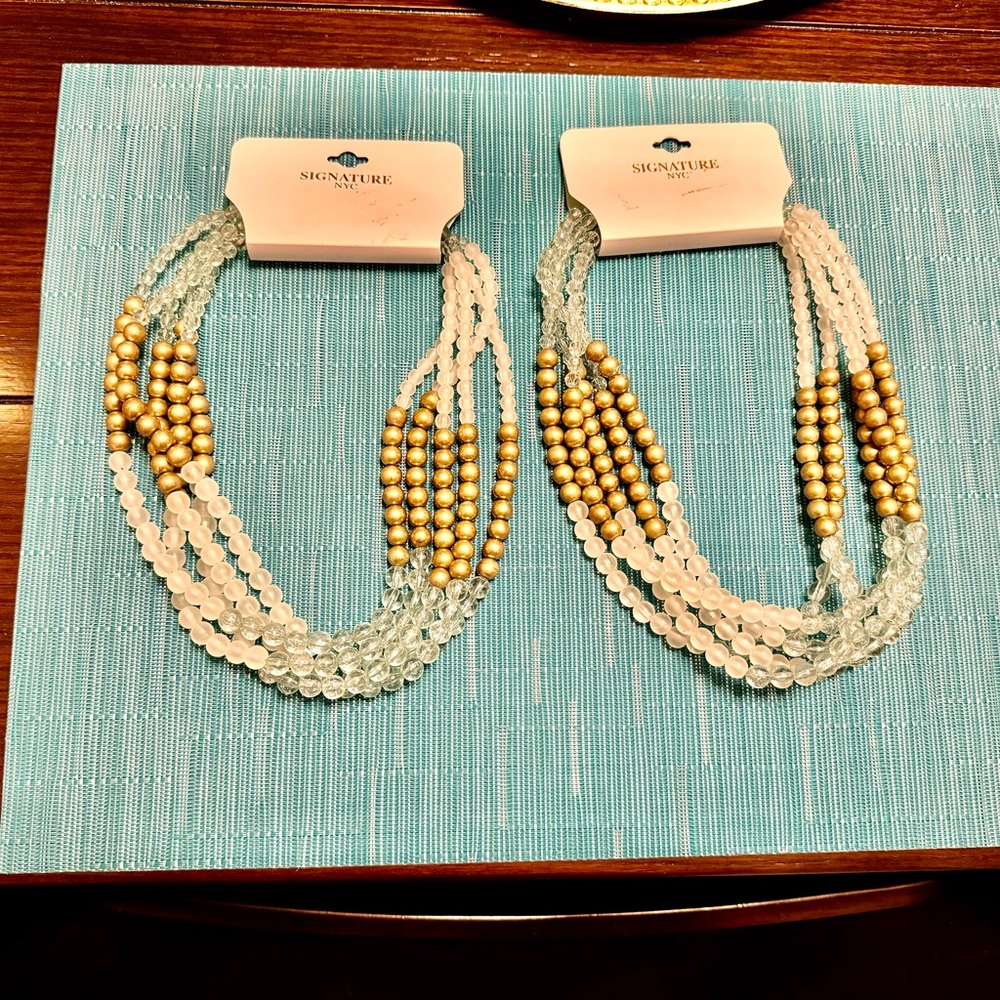 Gold,clear and blueish greenish beaded necklace .